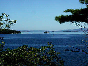 Our spectacular view of Pumpkin Island's Lighthouse, Pond Island, Islesboro, and the Distant Camden Hills.